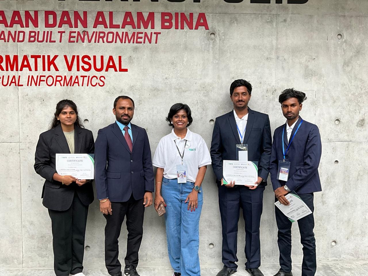 KRCT students and faculty with certificates at an international conference in Malaysia