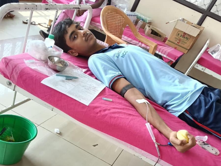 A cadet donating blood at the Government Hospital, Trichy