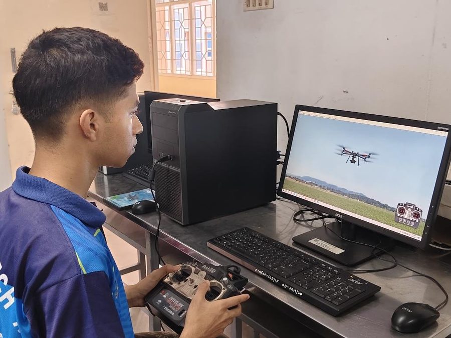 A cadet flying a drone on a simulator