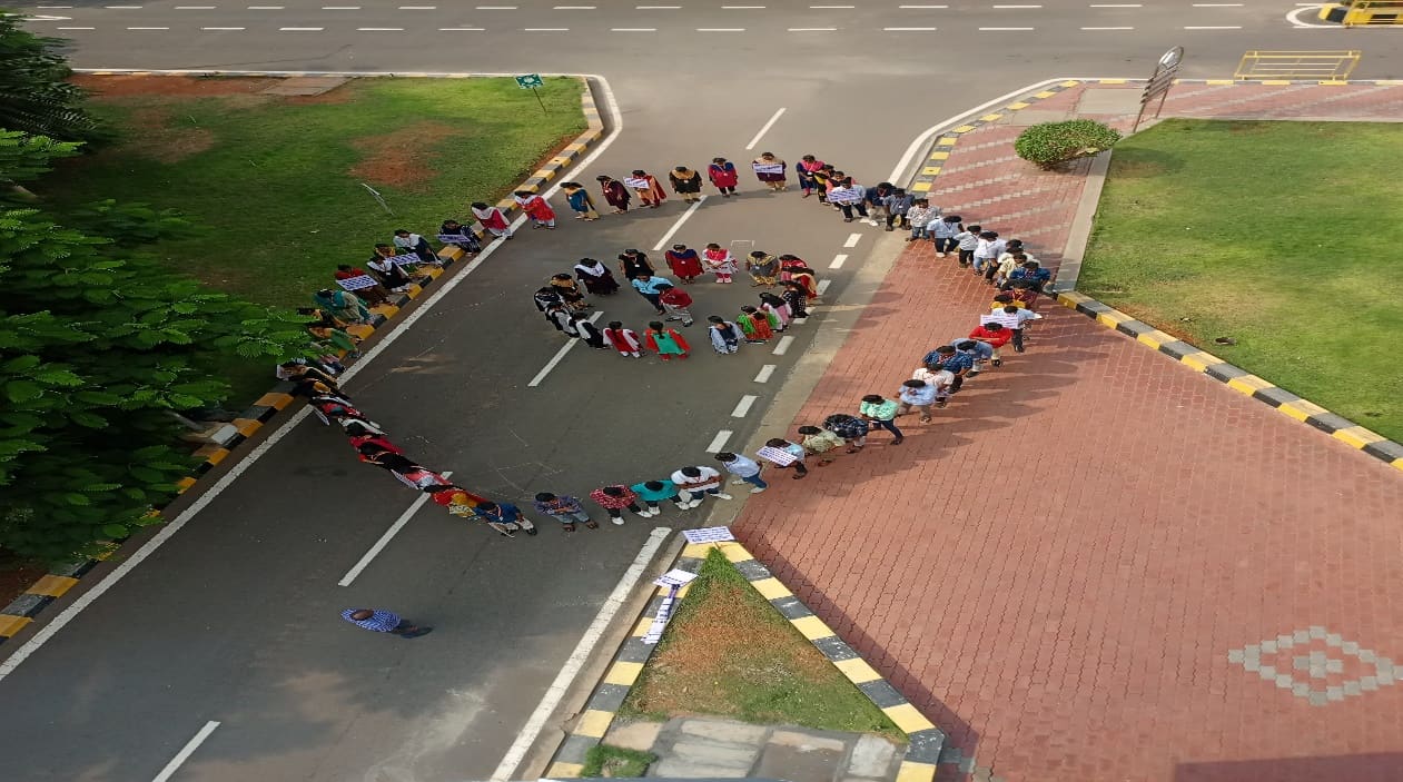 NSS volunteers forming the letters NSS on the KRCT campus