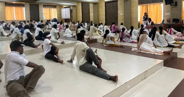 Students following the session from the hall floor
