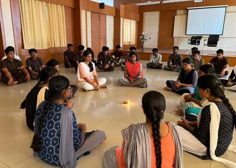 Students seated in a circle for a meditation session