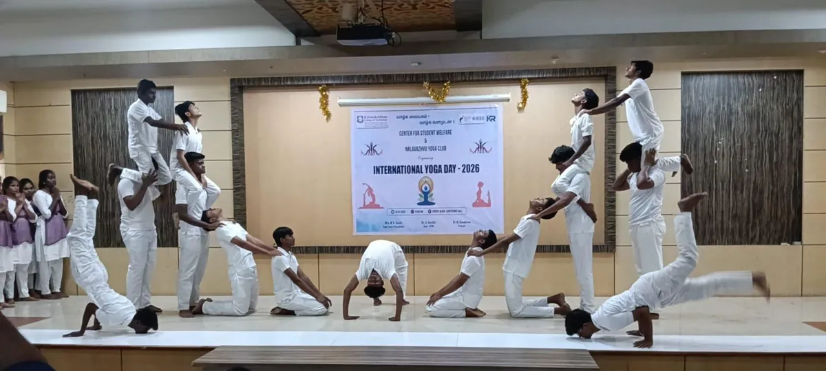 Club members holding a balance sequence on stage