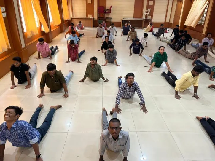 Students seated in a circle mid-sequence