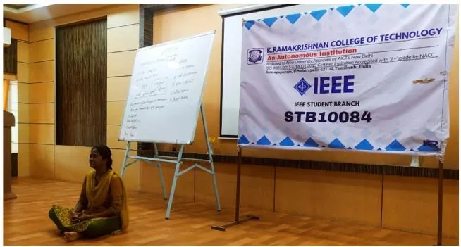 The trainer leading a warm-up drill in the seminar hall