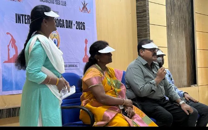 The compère addressing the Yoga Day gathering