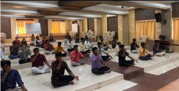 Participants seated on the hall floor